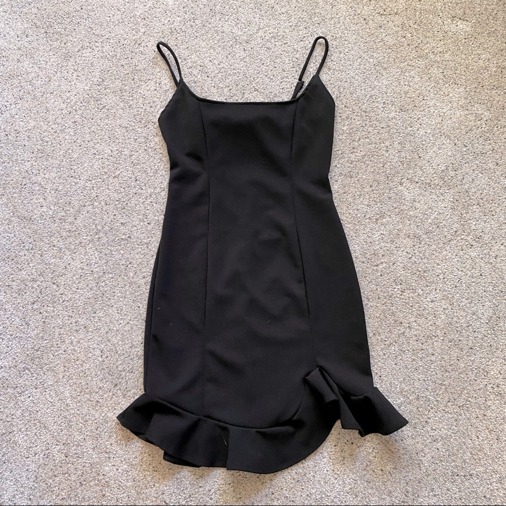 Very cute, new without tags little black soup dress. Size small.